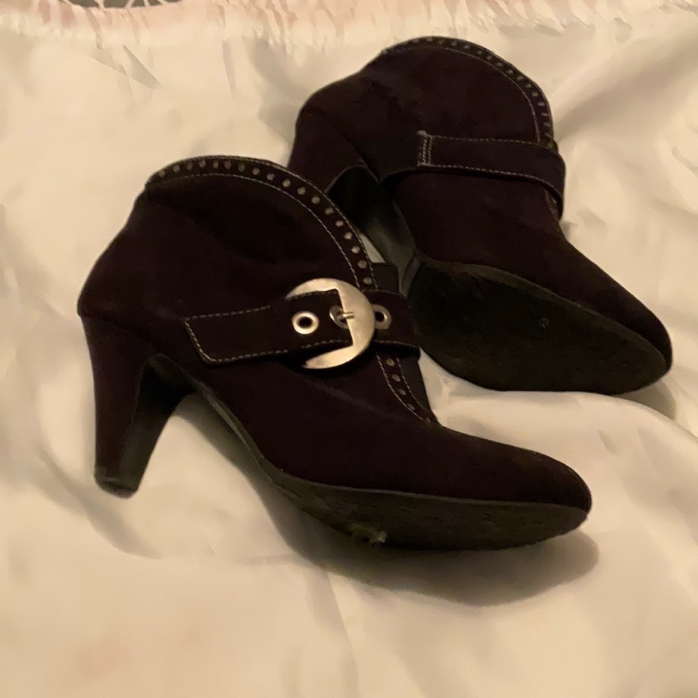 Black suade bootee shown in glare magazine.